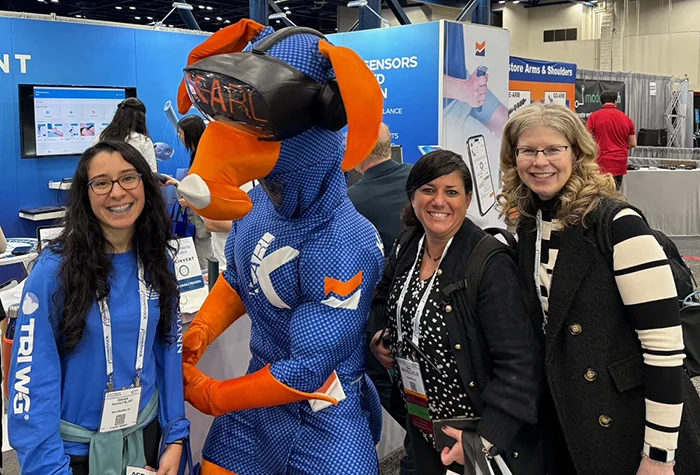 Gabriela Ba, Dr. Bell and Dr. DiCecco pose with vendor mascot