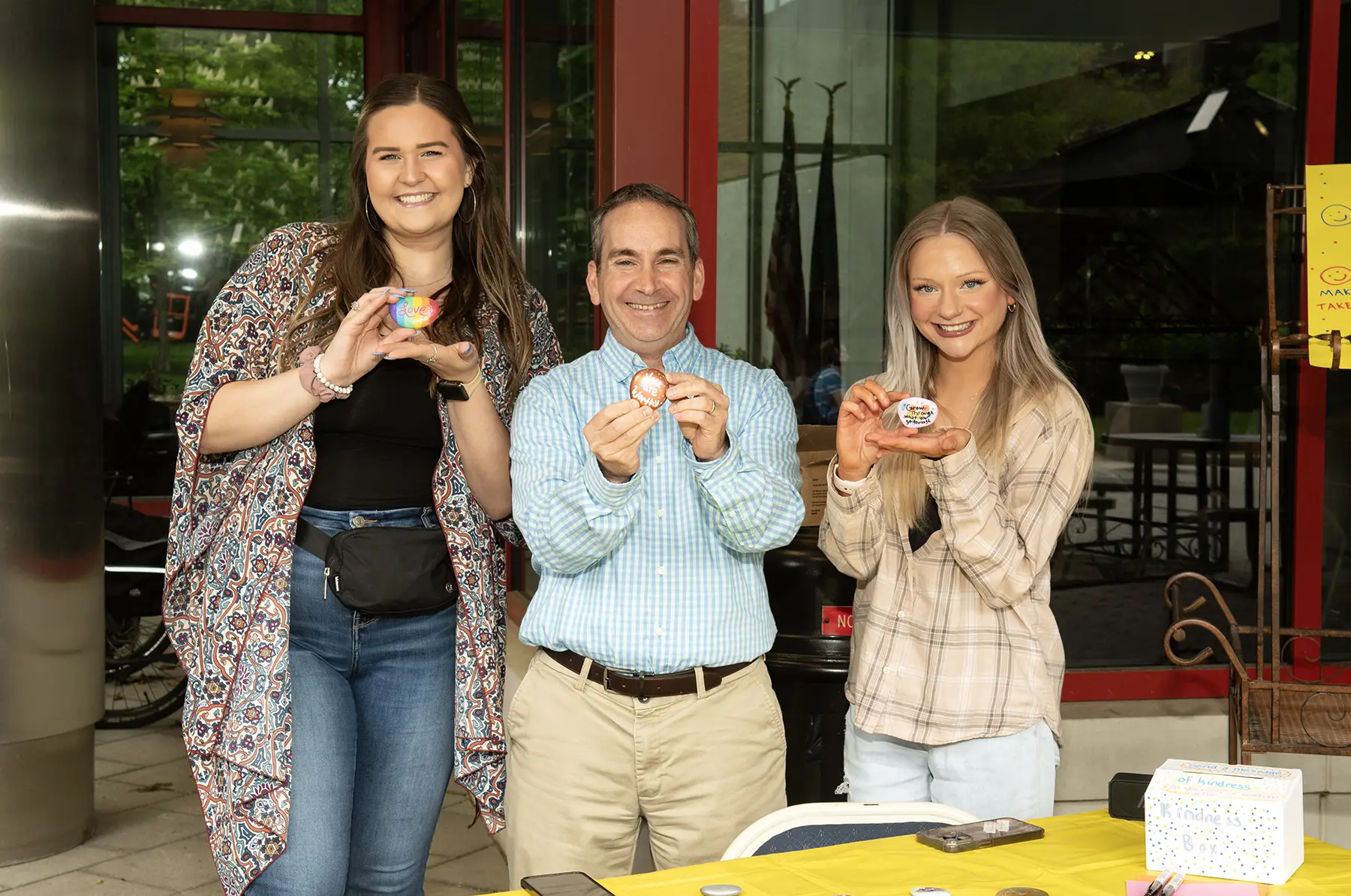 Dr. Scott Glassman is shown with two positive psychology students.