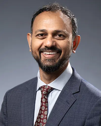 Professional headshot photo of John Khan, Chief of Campus Operations - PCOM Georgia