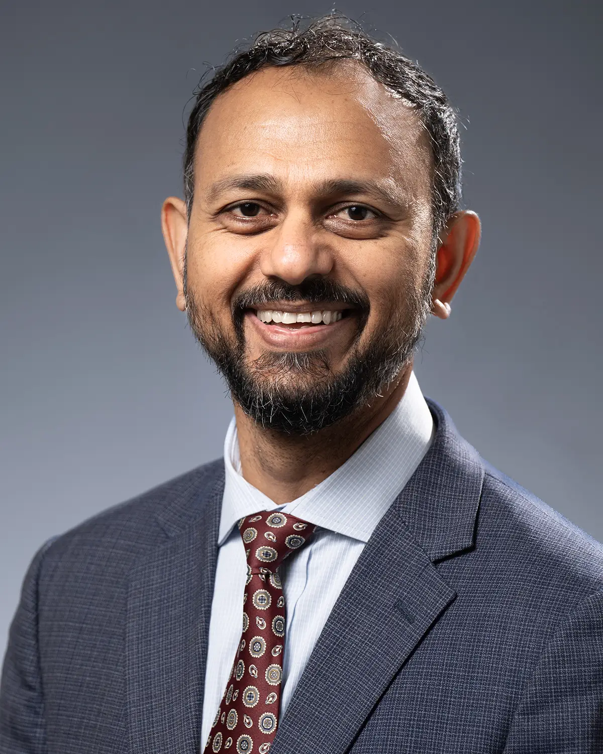 Professional headshot photo of John Khan, chief of campus operations at PCOM Georgia