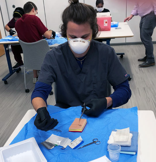 Medical student practicing in the PCOM South Georgia Simulation Center