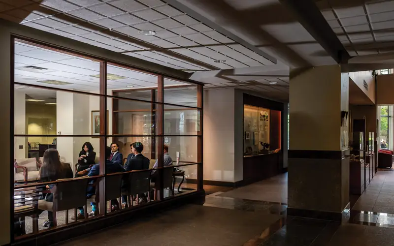 A glimpse through the glass windows of the PCOM Admissions Office reveals aspiring physicians navigating crucial moments of their medical school interviews. Inside, hopeful candidates engage in thoughtful conversations, showcasing their passion and dedication for the profession.