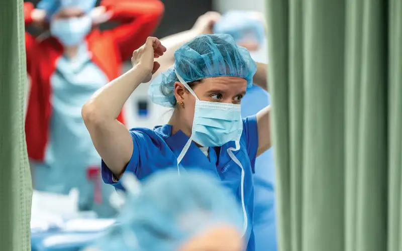 PCOM doctor of osteopathic medicine students diligently practice surgical scrubbing, gowning and gloving at the Dr. Michael and Wendy Saltzburg Clinical Learning & Assessment Center, honing their fundamental skills for real-world clinical settings.