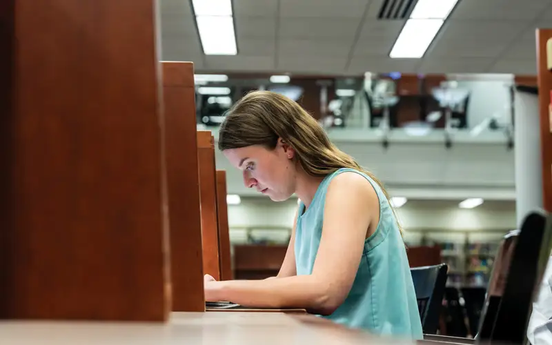 In PCOM’s O.J. Snyder Memorial Library, behind the bookcases lined with medical texts, a third-year student delves deeply into her studies.