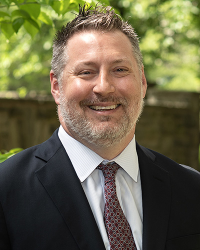 Professional headshot photograph of PCOM DO Program Dean Peter Bidey, DO