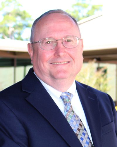Professional headshot photo of dean Robert Lloyd, DO