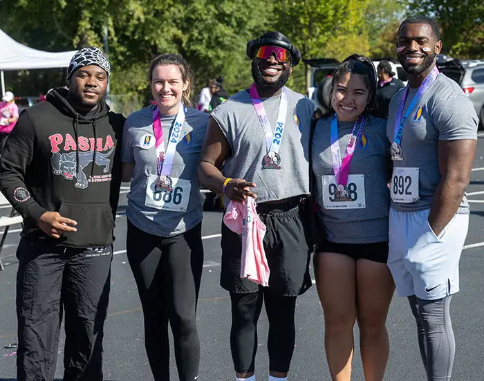 PCOM Georgia students in athletic gear during the Paint Gwinnett Pink 5K event