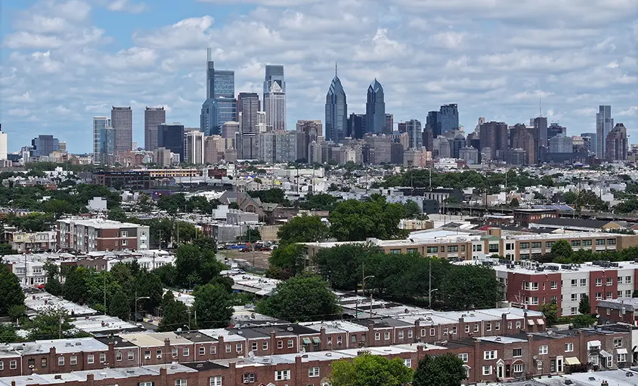 Aerial photo of Philadelphia neighborhoods and the city skyline in the background