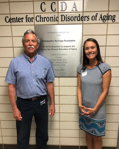 Dr. Balin and Nikki Schultek pose in front of the CCDA