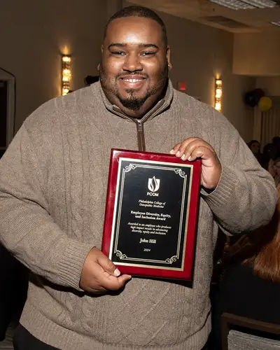 John Hill pictured with his award