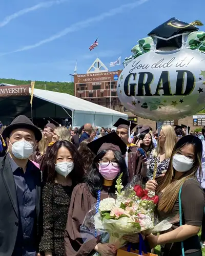 Wei and her family during her undergraduate commencement ceremony
