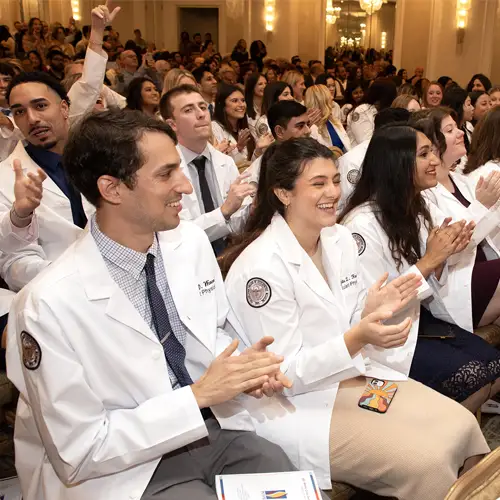 Students cheer and celebrate at the 2023 DO White Coat Ceremony (PCOM)