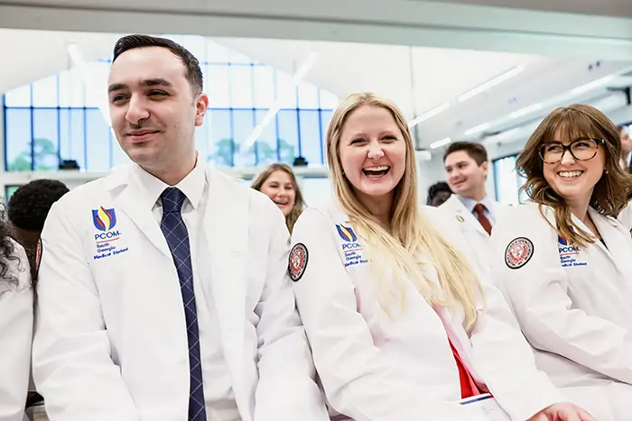 DO students sit together at the 2024 White Coat Ceremony