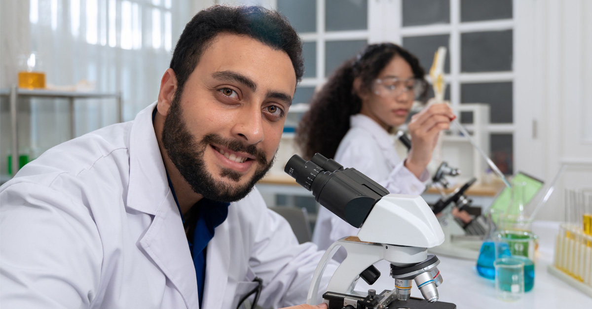 Medical laboratory scientist student smiles and works in a lab