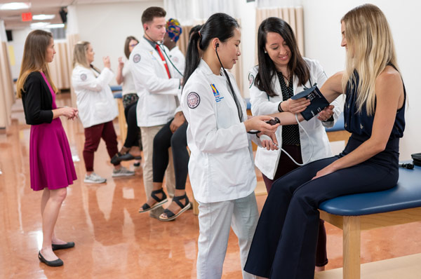 Physician assistant students provide a physical exam demonstration during PCOM Georgia campus tour